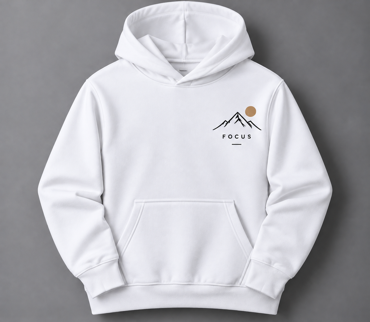 A white pullover hoodie with a small chest graphic featuring a black mountain outline, a tan sun, and the word 'FOCUS' printed below, shown against a dark gray background.