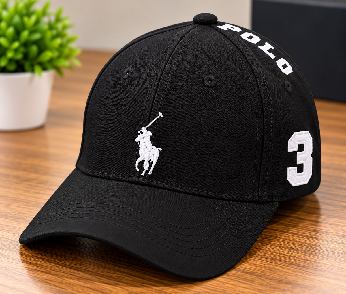 A black Polo Ralph Lauren baseball cap with white embroidered details, featuring the polo player logo on the front, 'POLO' text on the side, and a large number '3' on the back, resting on a wooden table.